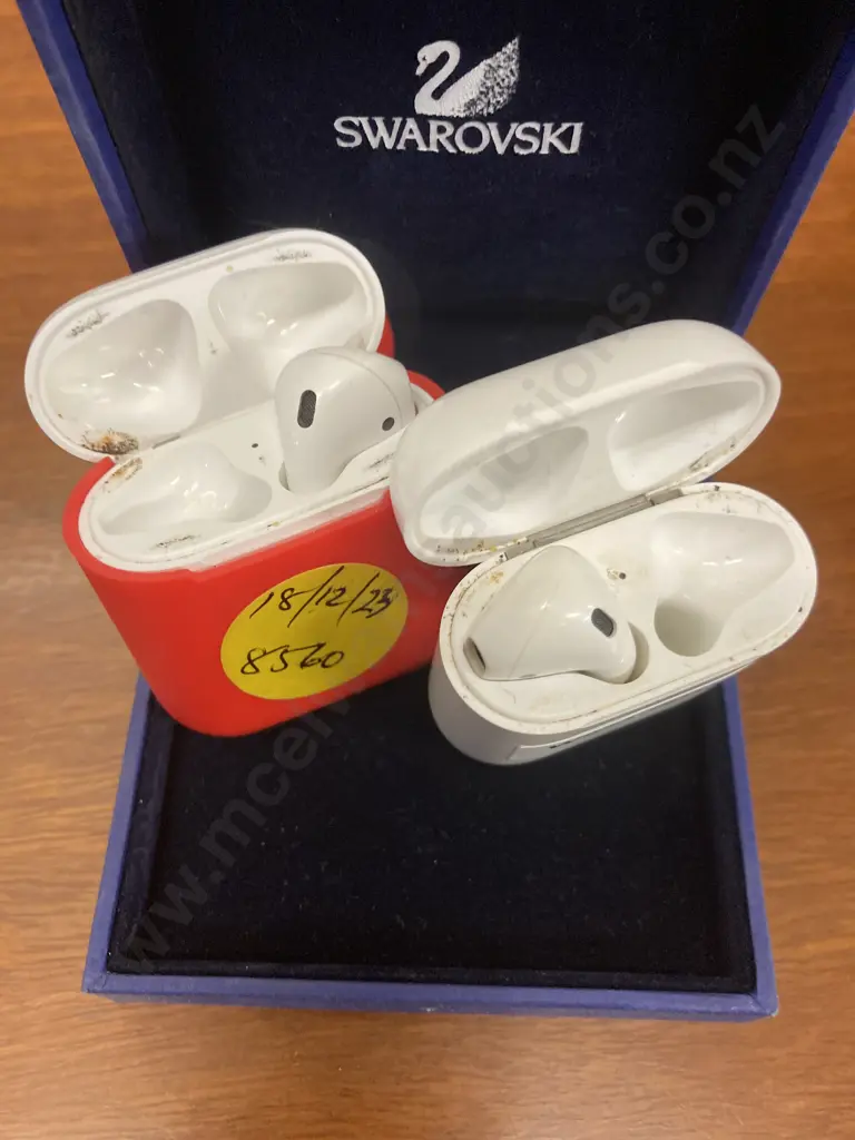 Pair of Single Apple AirPods With Charging Cases & a Red Cover (Model A1602) Image 1++